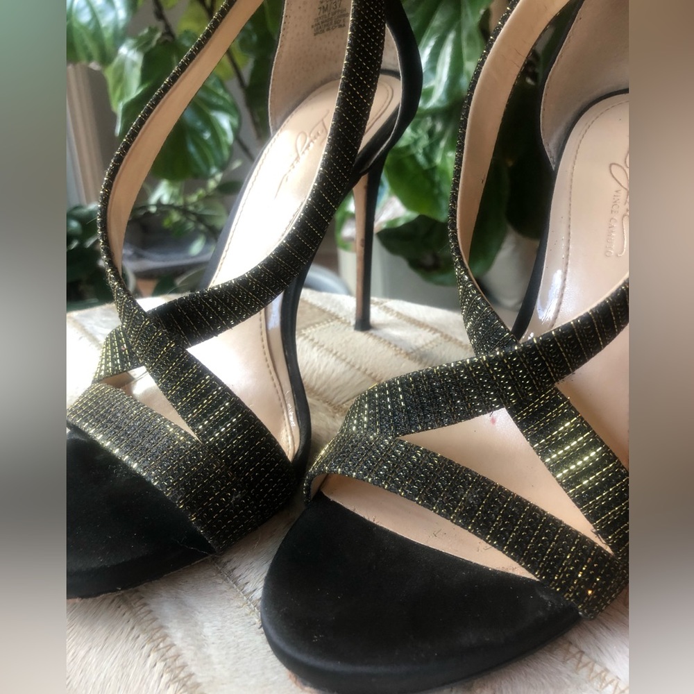 Size 7 VINCE CAMUTO brand. Black satin finish with gold accent straps.